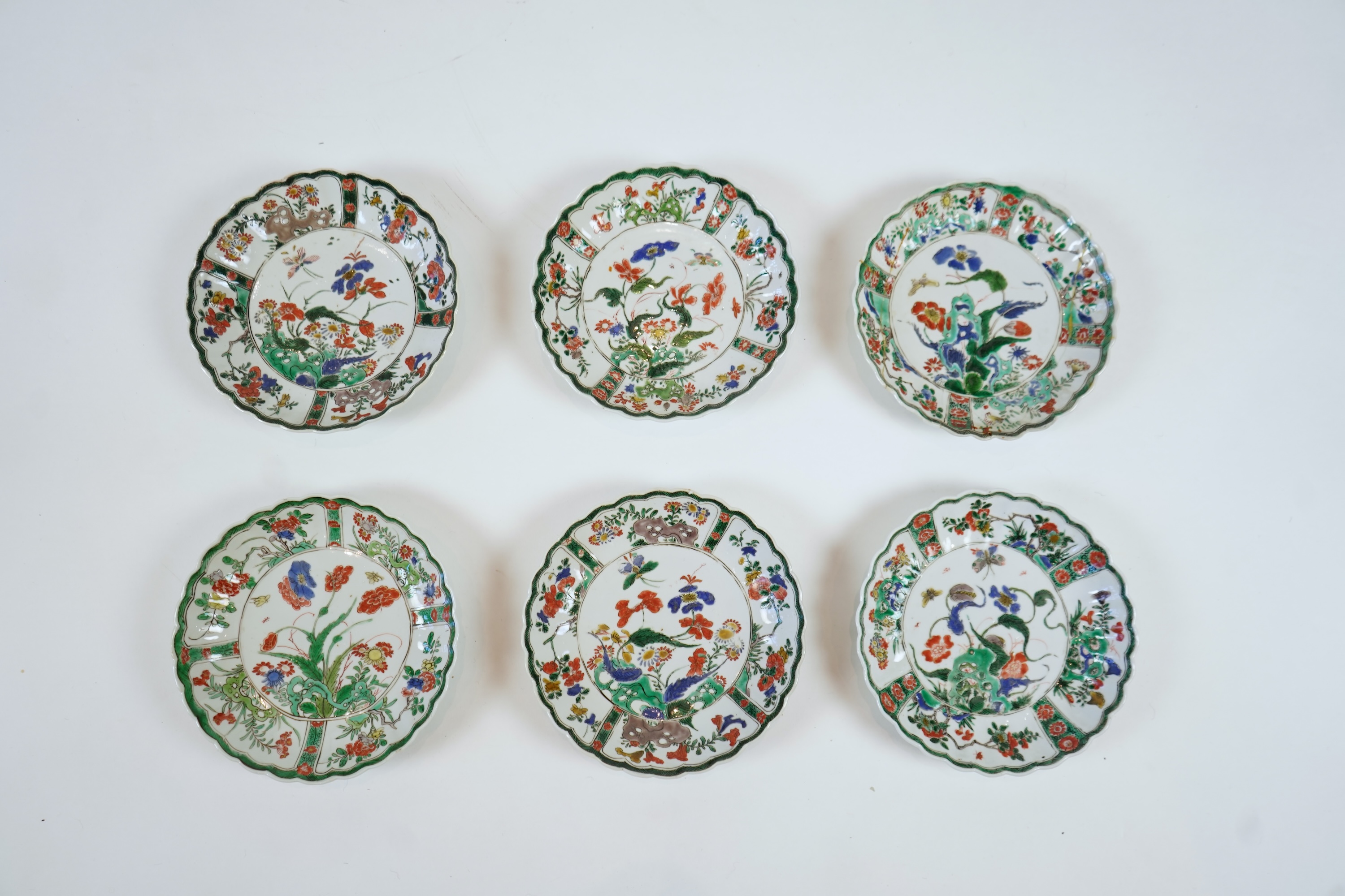 A set of six Chinese famille verte petal lobed saucer dishes, Kangxi period